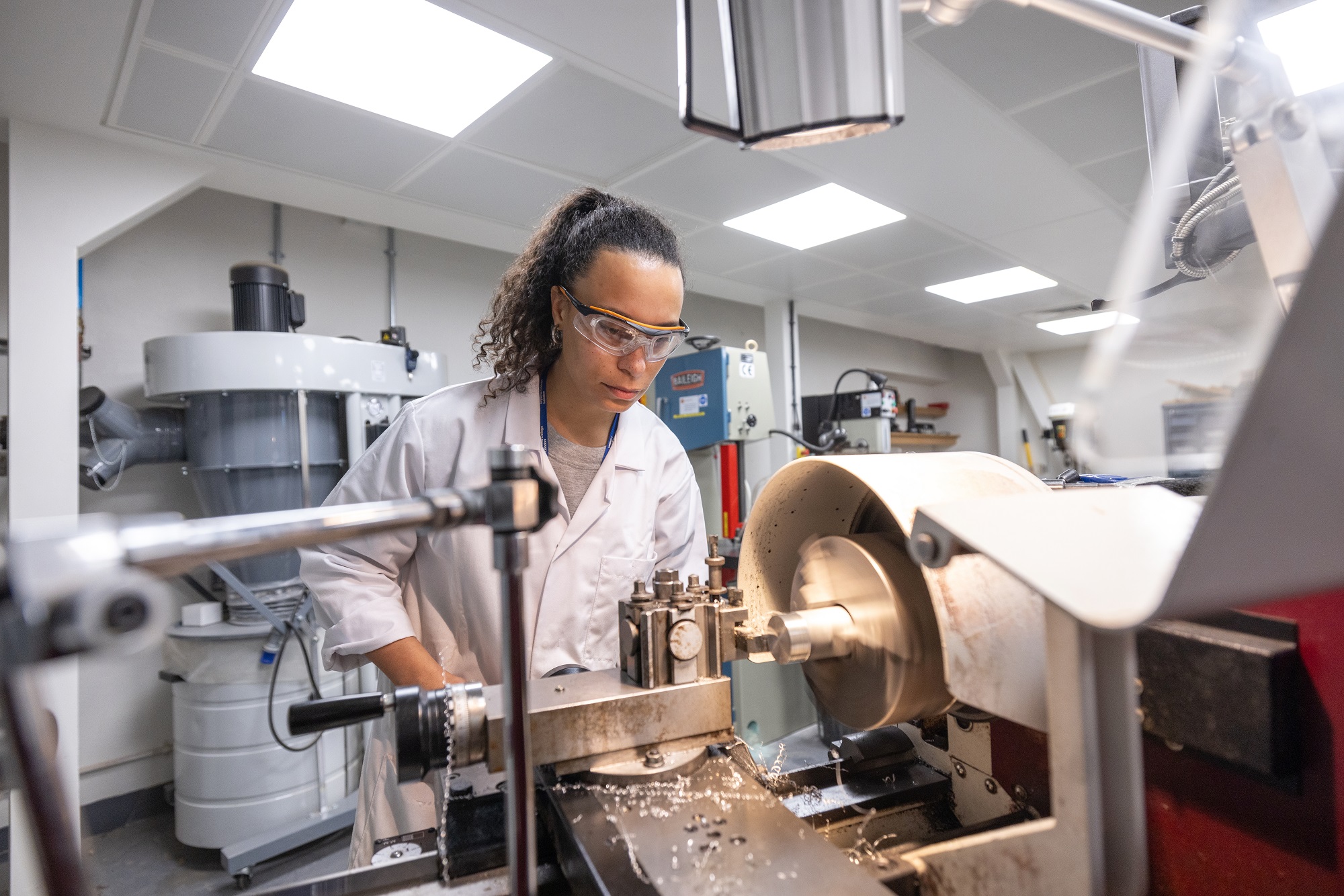 A student work at a machine in the Dyson School of Design Engineering. Photo taken: November 2023